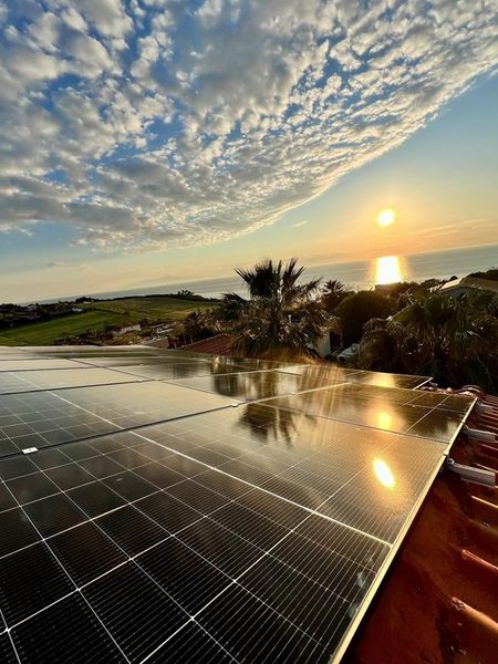 Rooftop solar panels at Potidea Apartments with Aegean sea view at sunset, Nea Potidea Halkidiki